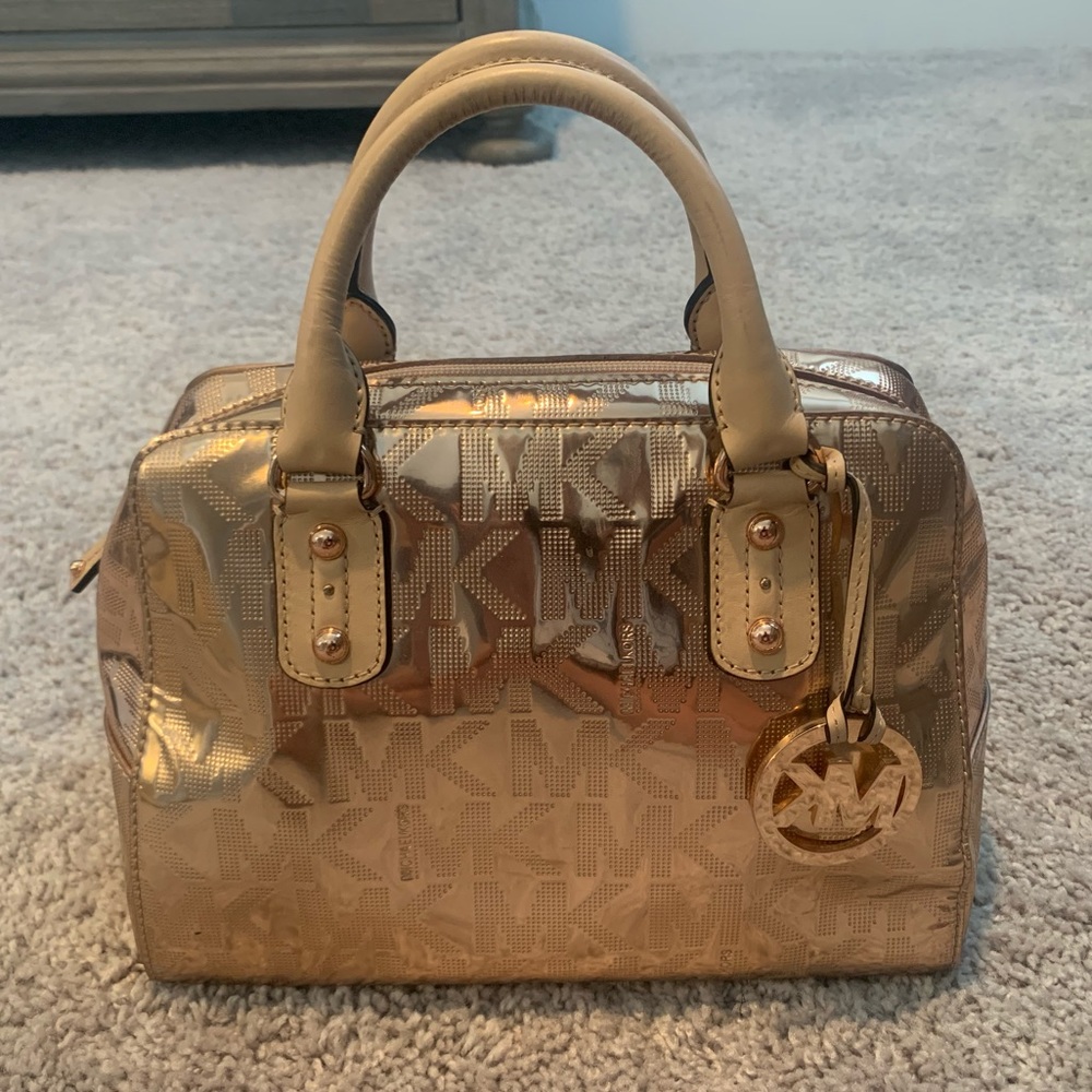 Michael Kors rose gold purse with zipper